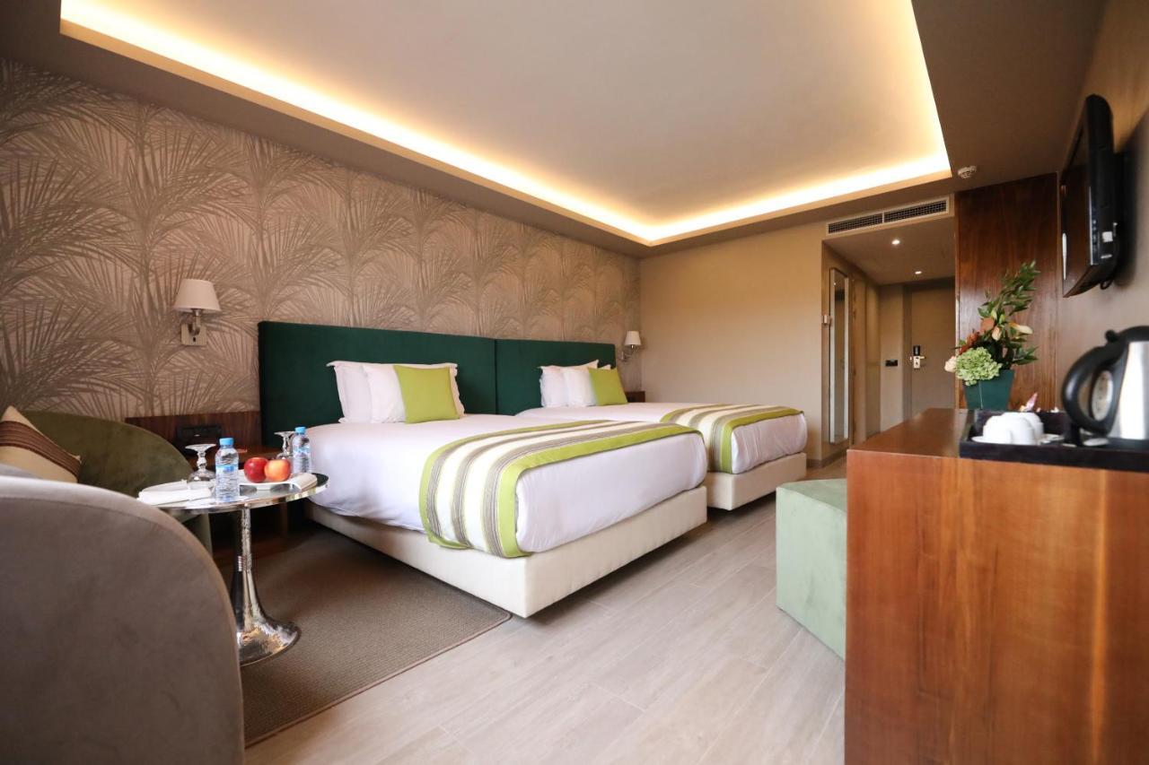 Hotel Kenzi Rose Garden Marrakesh Esterno foto A room at the hotel